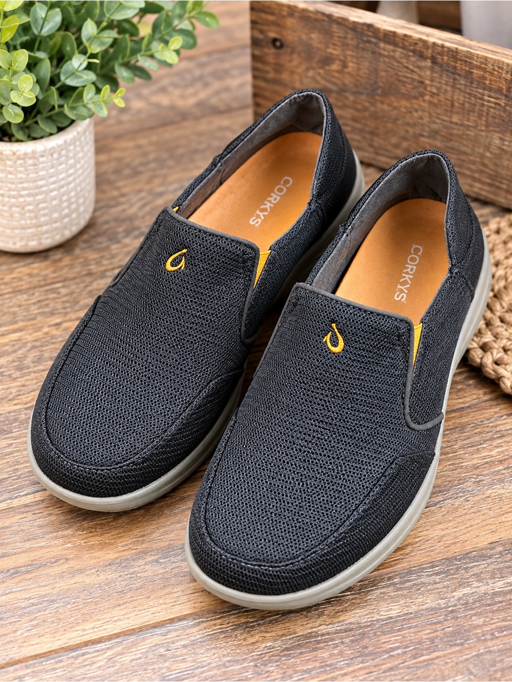 OluKai Black Slip-On Loafers with Yellow Accent